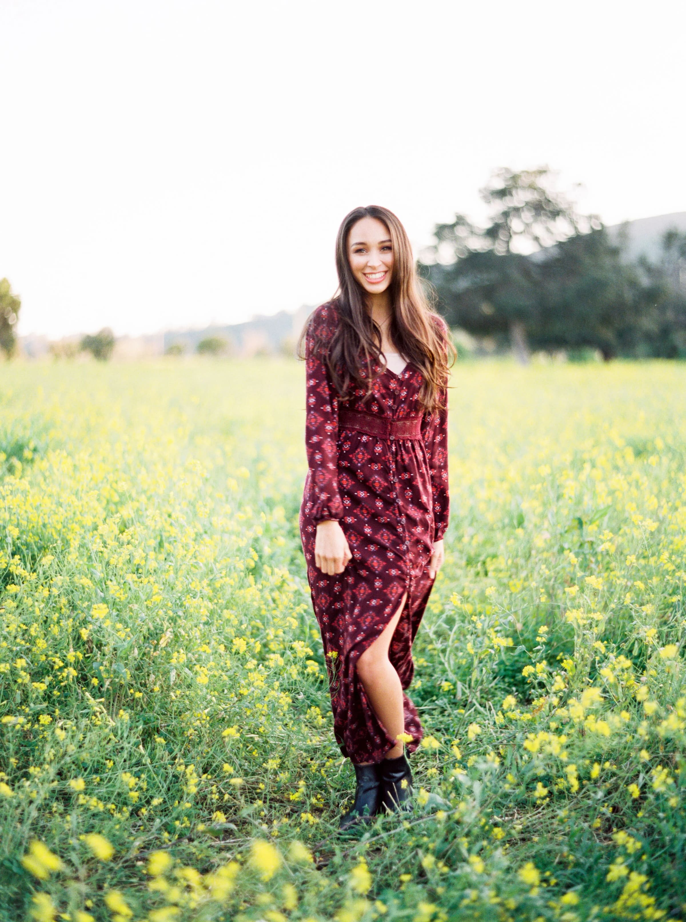 A portrait session on medium format film in a field of mustard flowers.